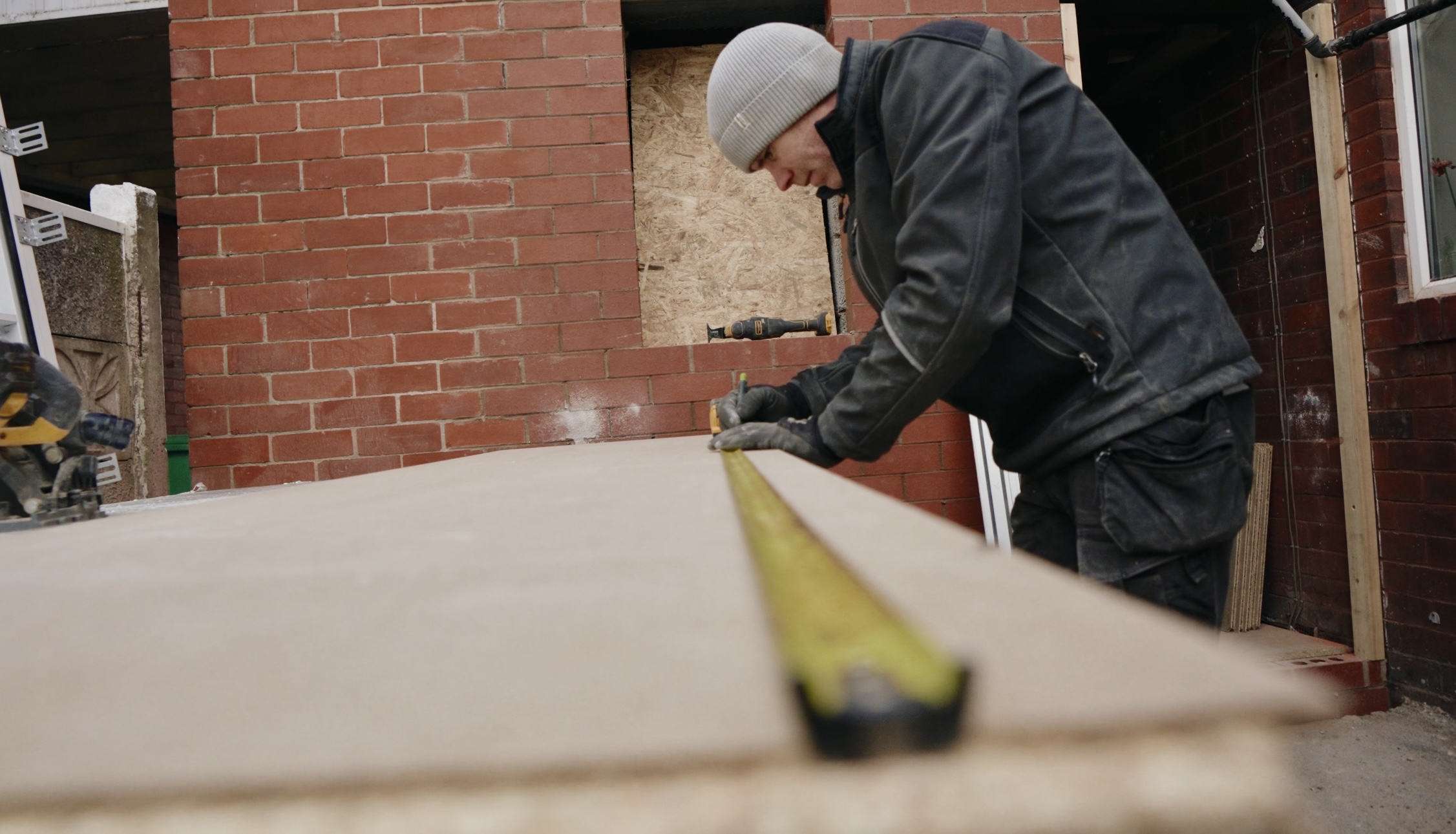 EveryTrade worker measuring something on site